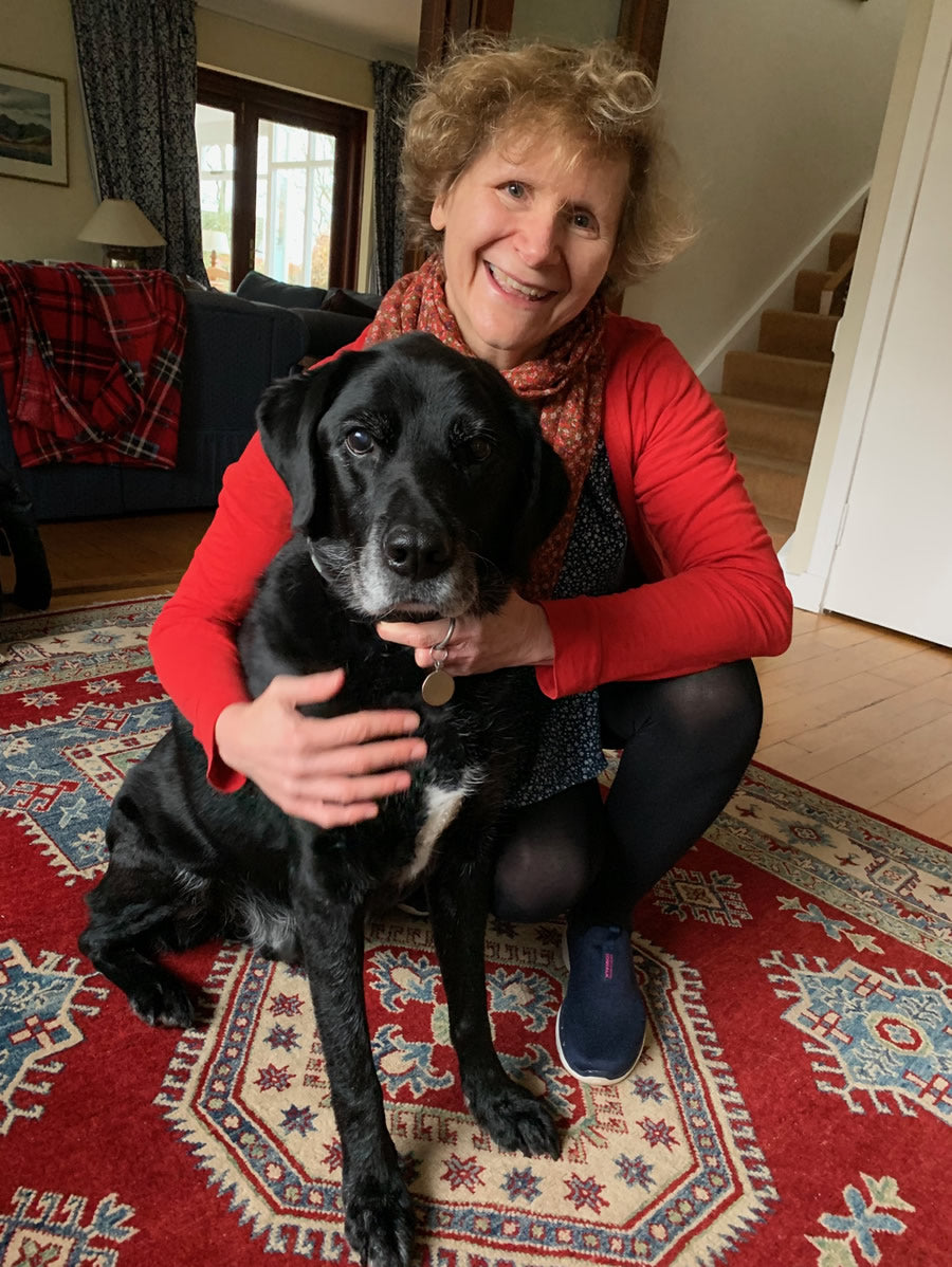 Dr Arielle Griffiths vegan vet with Labrador Jumble owned by vet oncologist Prof Clare Knottenbelt who put him onto a vegan diet