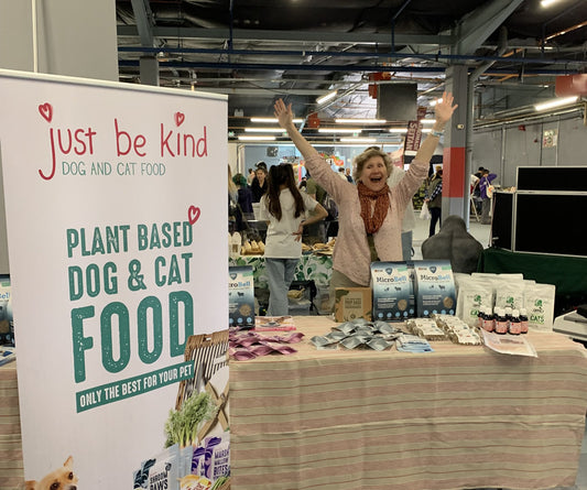 Dr Arielle celebrating at Bristol Vegfest with stand for Just Be Kind Dog Food