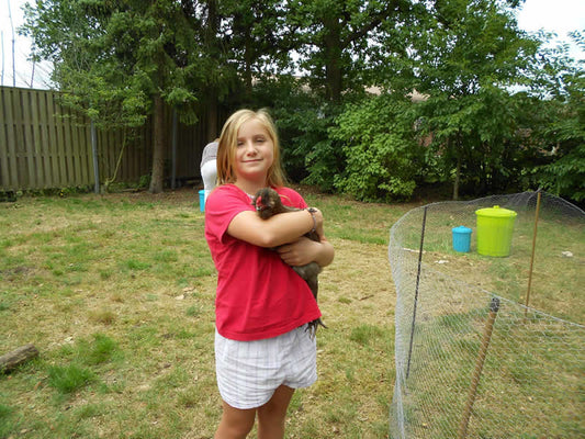 Emily holding Coco the chicken