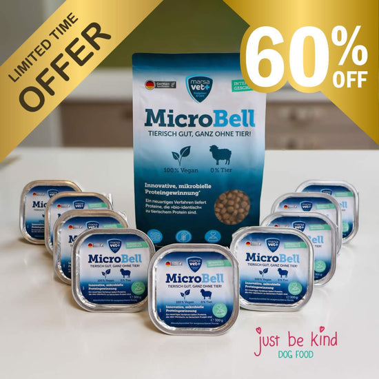 MicroBell dog food packaging set featuring a large blue bag and several silver trays of wet dog food arranged on a white surface, with promotional text overlays including 'LIMITED TIME OFFER' and '60% OFF'.