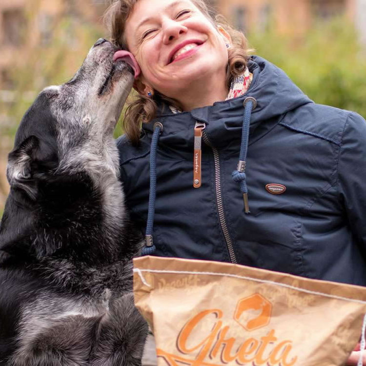 Dog licking someones face